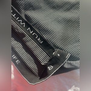 Lululemon, size 8, black and white striped, swiftly tech, lightly used.